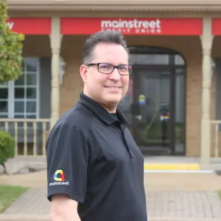 James Lounsbury standing in front of Goderich branch.
